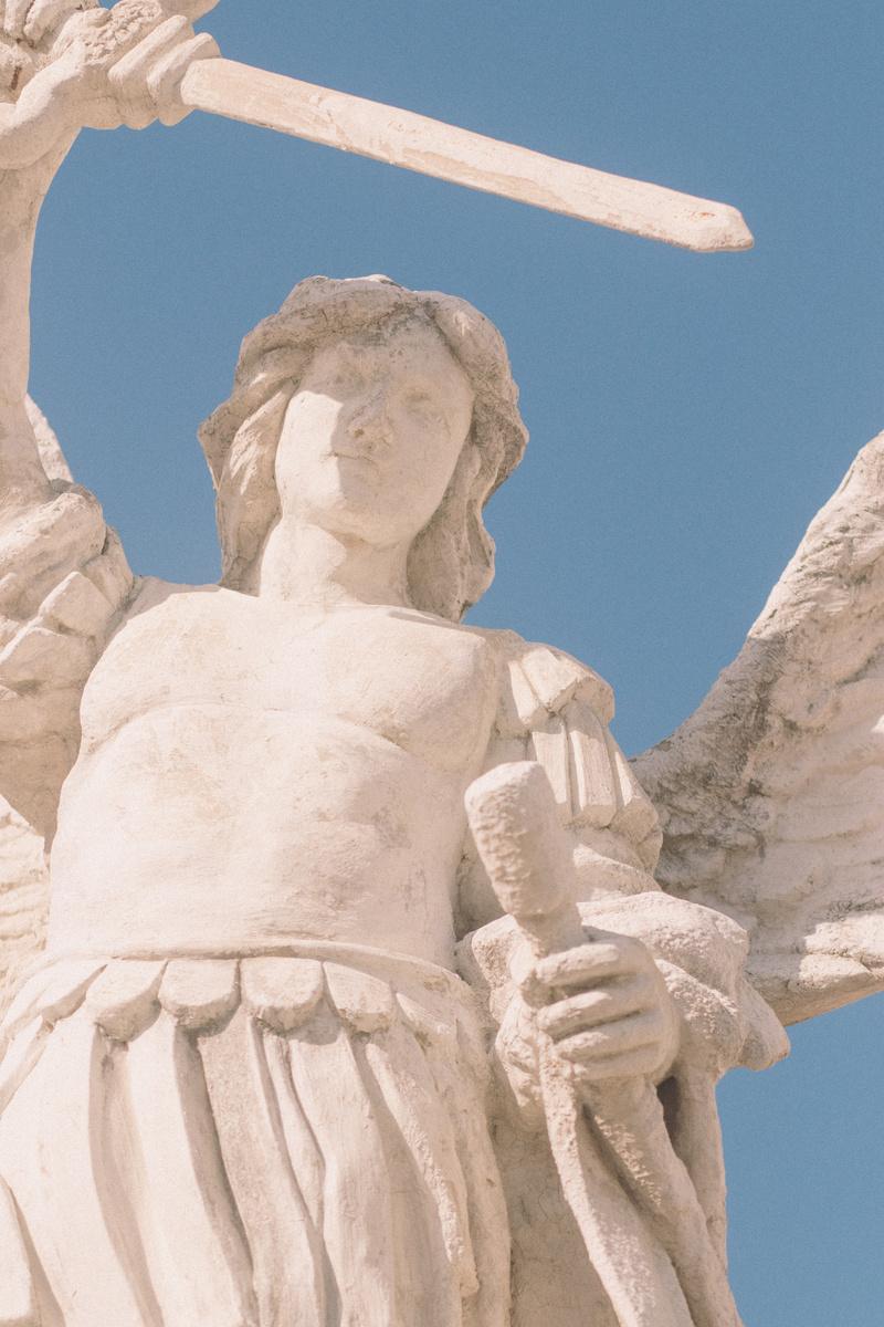Statue of Archangel Michael against the Blue Sky